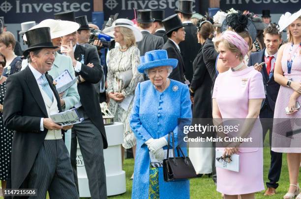 Queen Elizabeth II watches the runners in the parade ring for the Epsom Derby at Epsom Racecourse on June 1, 2019 in Epsom, England.