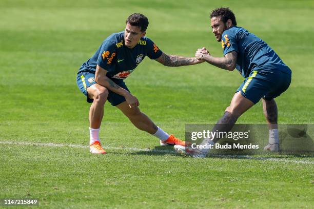 Phillipe Coutinho and Neymar Jr in action during a training session of the Brazilian national football team at the squad's Granja Comary training...