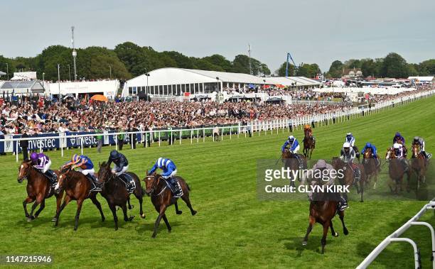 Jockey Seamie Heffernan rides Anthony Van Dyck to victory in the Derby Stakes on the second day of the Epsom Derby Festival in Surrey, southern...