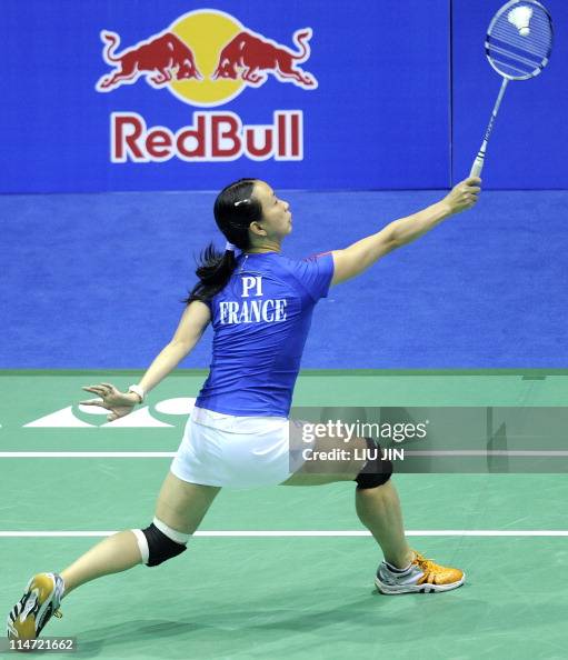 Pi Hongyan Pi Hongyan of France returns a shuttlecock against Larisa Griga of ...