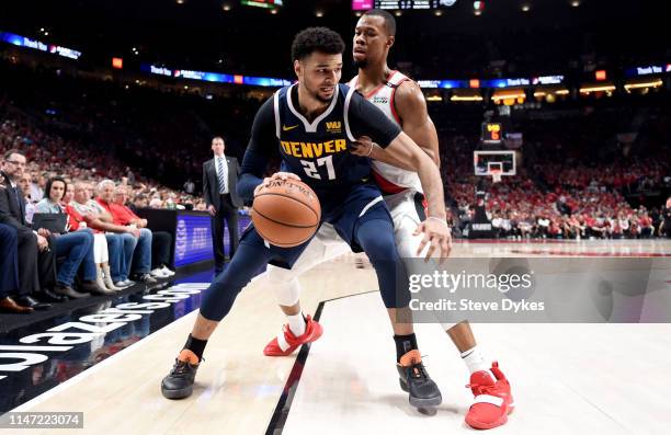 Jamal Murray of the Denver Nuggets drives to the baskey on Rodney Hood of the Portland Trail Blazersduring the second half of game four of the...