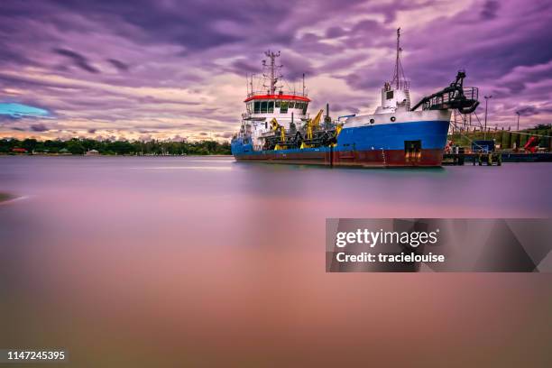 sand dredger at dusk - dredger stock pictures, royalty-free photos & images