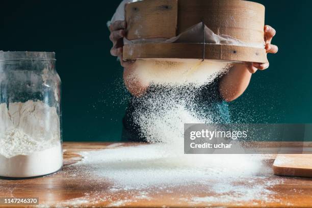 flour for dough - sifting stock pictures, royalty-free photos & images