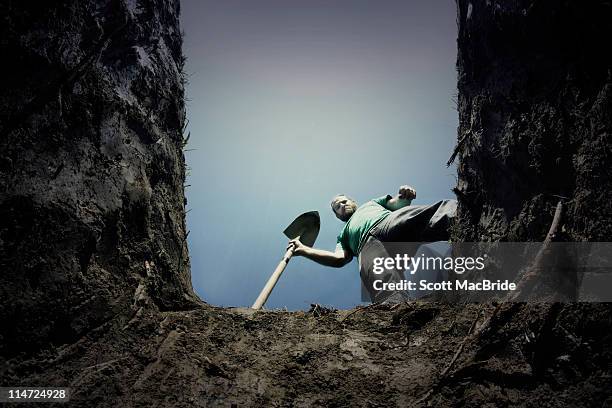 man looking into agrave - excavation stock pictures, royalty-free photos & images