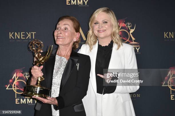 Judge Judy Sheindlin, with her Lifetime Achievement Award, and Amy Poehler attend the 46th Annual Daytime Emmy Awards - Press Room at Pasadena Civic...