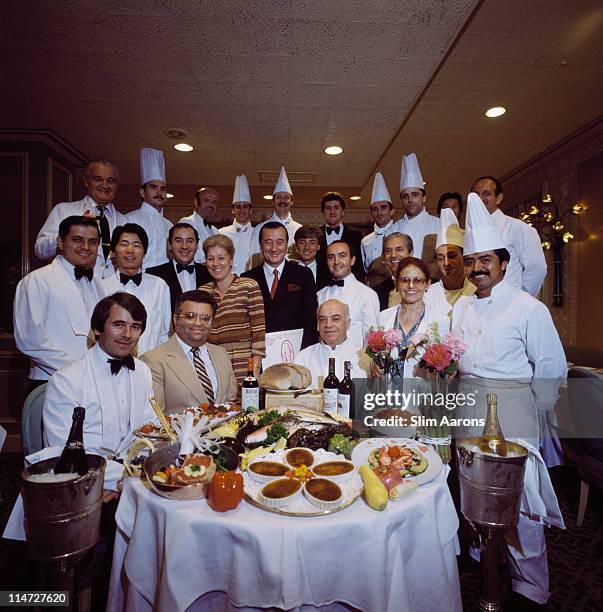 Italian-born restaurateur Sirio Maccioni with staff at Le Cirque, his establishment in New York, June 1984.