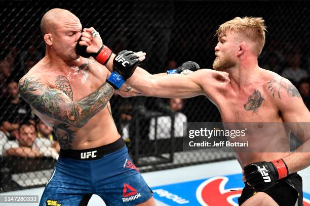 Alexander Gustafsson of Sweden punches Anthony Smith in their light heavyweight bout during the UFC Fight Night event at Ericsson Globe on June 1,...