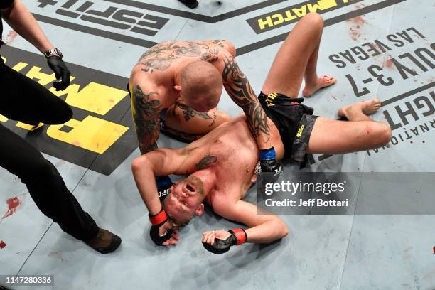 Anthony Smith embraces Alexander Gustafsson of Sweden after their light heavyweight bout during the UFC Fight Night event at Ericsson Globe on June...