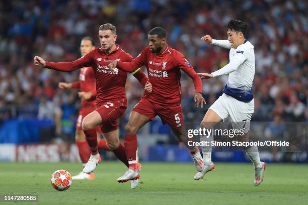 Son Heung-Min of Spurs battles with Georginio Wijnaldum of Liverpool and Jordan Henderson of Liverpool during the UEFA Champions League Final between...