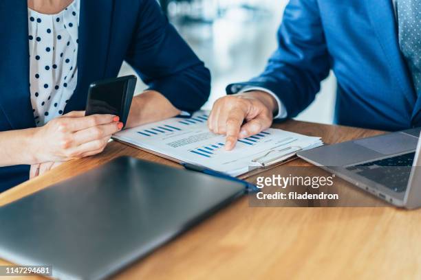 discussing the report with the ceo - personal perspective office stock pictures, royalty-free photos & images