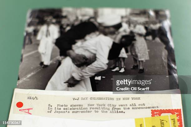 Black and white print of a couple kissing in Times Square on VJ Day, taken by Alfred Eisenstaedt, is laid out from the vast collection of historic...