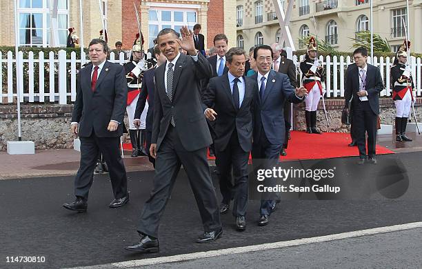 President Barack Obama waves as he emerges with President of the European Commission Jose Manuel Barroso, British Prime Minister David Cameron,...