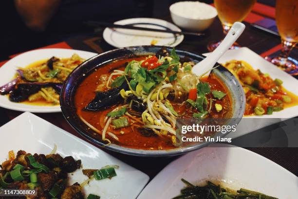 spicy chinese cuisines (sichuan dishes) served at a chinese restaurant in paris, france - france chili stock pictures, royalty-free photos & images