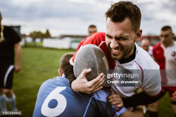 blocking in rugby match! - offense sporting position stock pictures, royalty-free photos & images