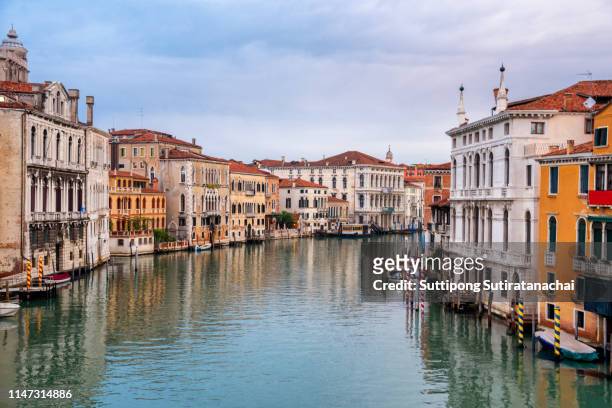 landscape view of canal bridge and building in early morning with no people no tourist as beautiful amazing view and attraction in venice , italy - castello stock pictures, royalty-free photos & images