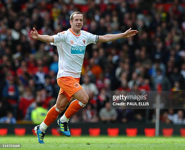 Blackpool's Scottish midfielder Charlie Adam celebrates after scoring during the English Premier League football match between Manchester United and...