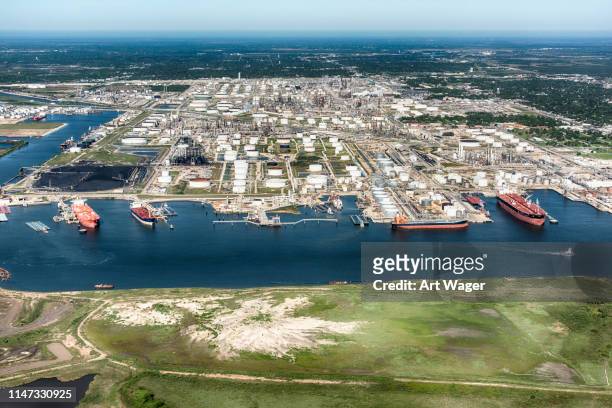 oil tankers docked at an american refinery - houston texas stock pictures, royalty-free photos & images