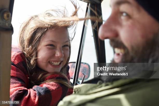 happy daughter looking at father in car - daughter car stock pictures, royalty-free photos & images