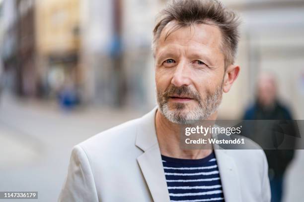 portrait of mature man with greying beard - tourist asking stock pictures, royalty-free photos & images