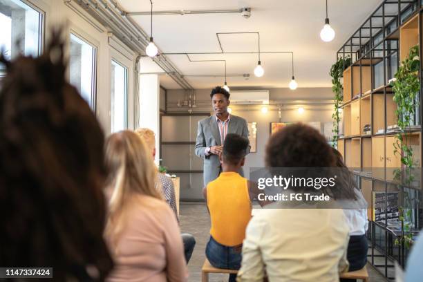 speaker and audience at business convention and presentation - teaching staff stock pictures, royalty-free photos & images