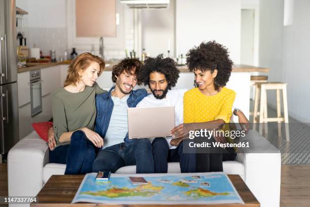 friends meeting to plan vacations, checking map - booking vacations stock pictures, royalty-free photos & images