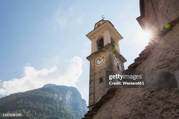 switzerland, ticino, sonogno, historic village church, clock tower - ticino canton stock pictures, royalty-free photos & images