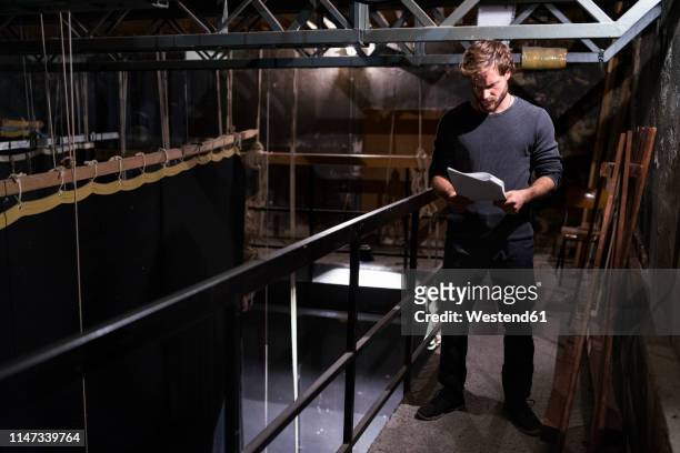actor at theatre studying script backstage - man backstage stock pictures, royalty-free photos & images
