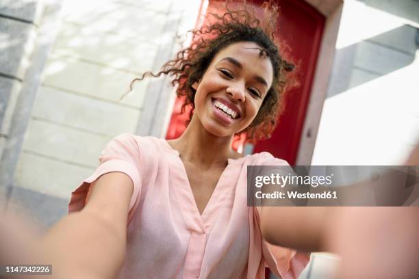 selfie of a happy young woman in the city - black blouse stock pictures, royalty-free photos & images