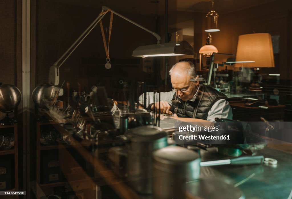 Artisan making jewellery in his workshop
