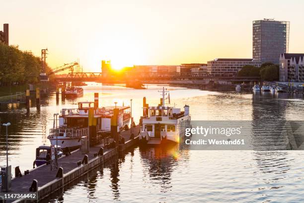 germany, free hanseatic city of bremen, schlachte, weser, jetty, excursion boats, stephani bridge, weser tower, high rise, sunset - bremen stock pictures, royalty-free photos & images