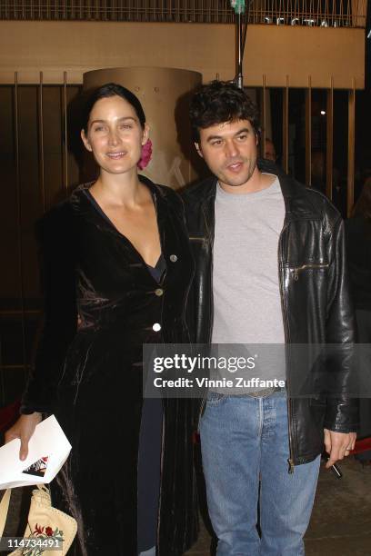 Carrie-Anne Moss and Steven Roy attending the premiere of "The Cooler" at the The Egyptian Theater in Hollywood, Ca 11/25/03