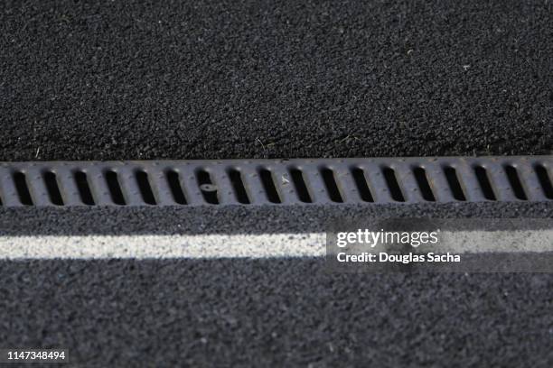 covered drain in a long trench - drain stock pictures, royalty-free photos & images