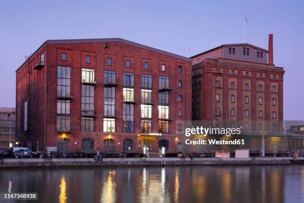 germany, muenster, city harbour, kreativkai, hall of arts in the evening light - north rhine westphalia bildbanksfoton och bilder