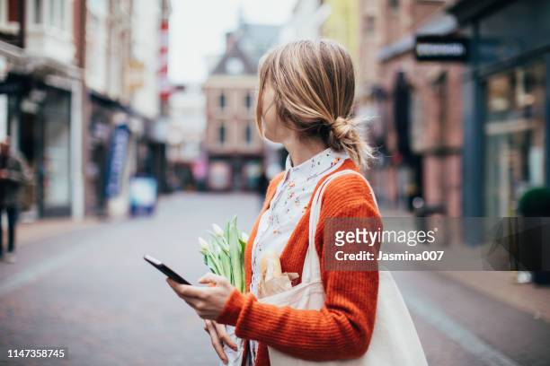 using mobile phone outdoors - utrecht stock pictures, royalty-free photos & images