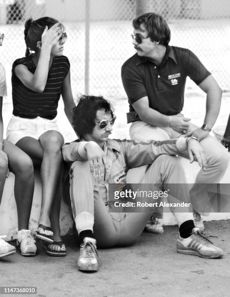 Driver Dale Earnhardt Sr. Relaxes with his wife, Teresa, and Jay Wells, a motorsports public relations and marketing official, prior to the start of...