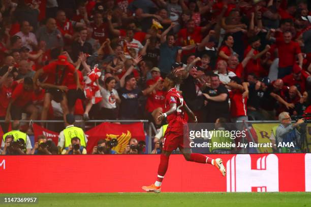 Divock Origi of Liverpool celebrates scoring a goal to make the score 0-2 during the UEFA Champions League Final between Tottenham Hotspur and...