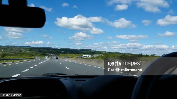 traffic jam from the driver's perspective. summer time - point of view driving stock-fotos und bilder