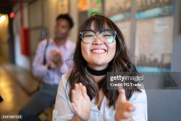 audience applauding a great speaker at business convention and presentation - business milestones stock pictures, royalty-free photos & images