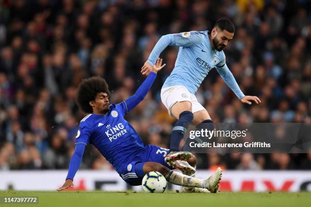 Ilkay Gundogan of Manchester City is challenged by Hamza Choudhury of Leicester City during the Premier League match between Manchester City and...