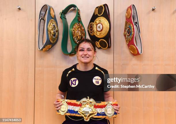 United States - 1 June 2019; Katie Taylor celebrates with her belts after her Undisputed Female World Lightweight Championship fight with Delfine...