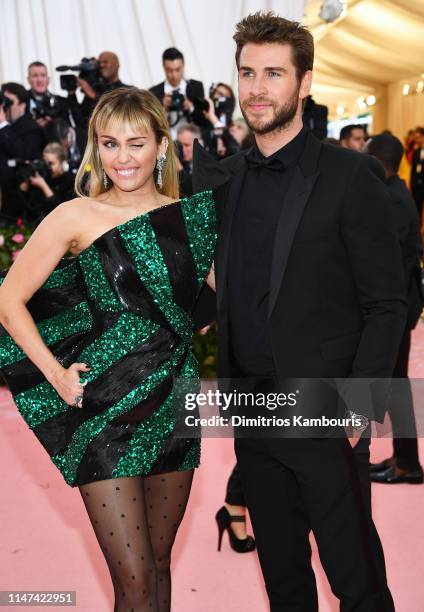 Miley Cyrus and Liam Hemsworth attend The 2019 Met Gala Celebrating Camp: Notes on Fashion at Metropolitan Museum of Art on May 06, 2019 in New York...