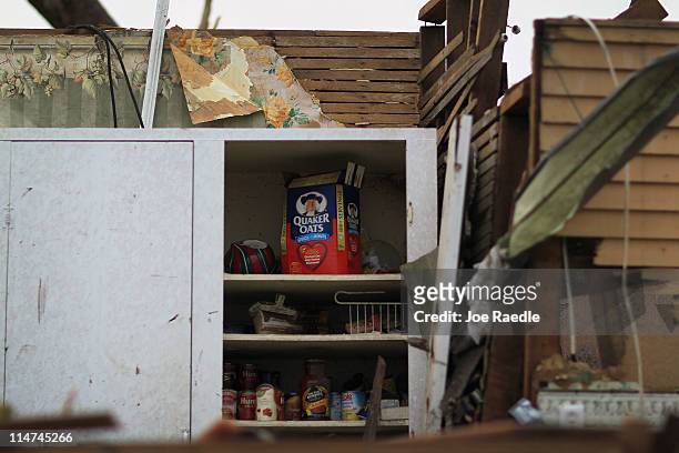 Cabinet with food is seen inside a pantry closet after the home was destroyed when a massive tornado passed through the town killing at least 125...