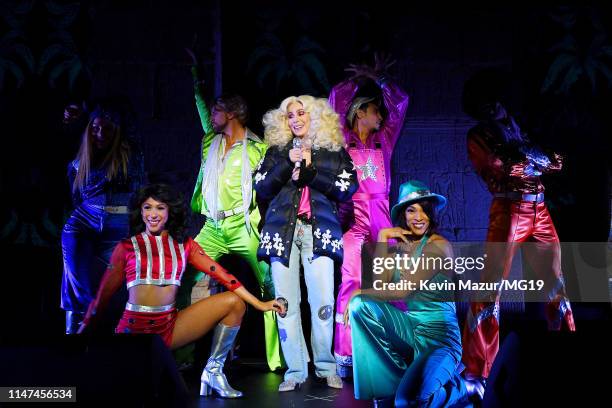 Cher - wearing a pink Givenchy top, black Ann Demeulemeester 1jacket, Rene Caovilla shoes, and personalized Relax jeans - performs onstage during The...