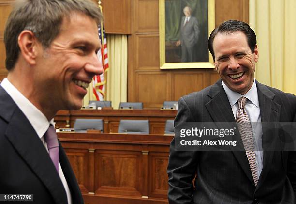 Chairman, CEO and president of AT&T Randall Stephenson and CEO of Deutsche Telekom AG Rene Obermann share a moment prior to a hearing before the...