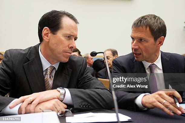 Chairman, CEO and president of AT&T Randall Stephenson listens to CEO of Deutsche Telekom AG Rene Obermann prior to a hearing before the Intellectual...