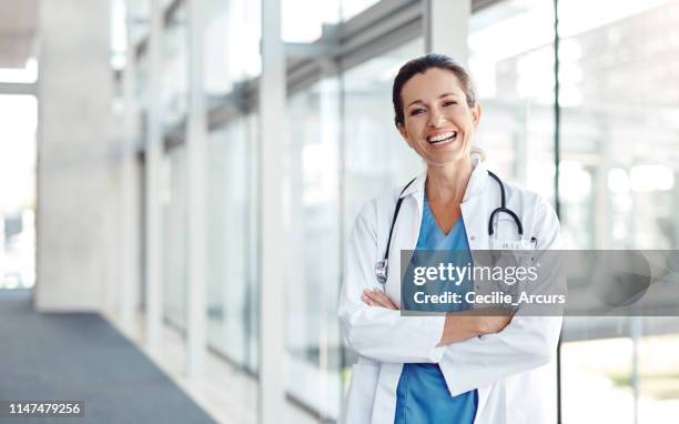 it brings me joy to help others - doctor looking at camera stock pictures, royalty-free photos & images