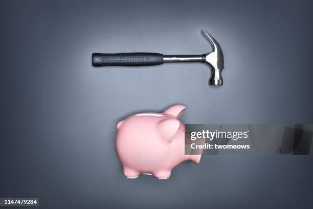 financial insecurity concept image. - smashed piggy bank stock pictures, royalty-free photos & images