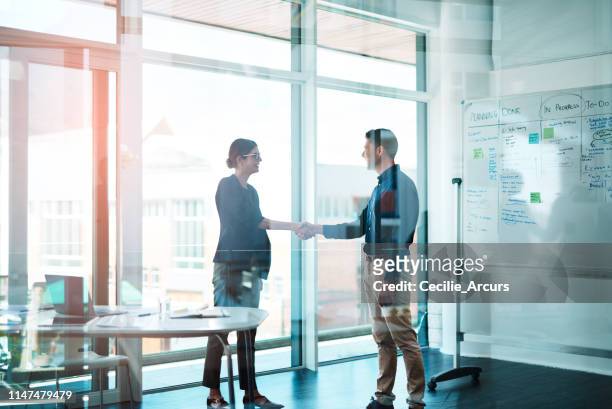 it's a win for you and a win for me - businessman and businesswoman shaking hands stock pictures, royalty-free photos & images