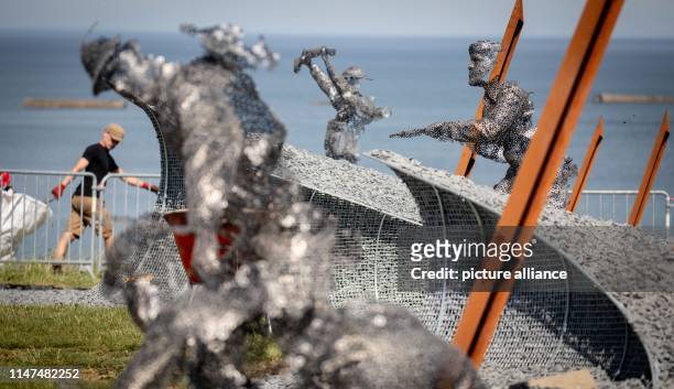 June 2019, France , Arromanches-Les-Bains: Sculptures showing British soldiers landing in the coastal town on Gold Beach can be seen in the D-Day 75...