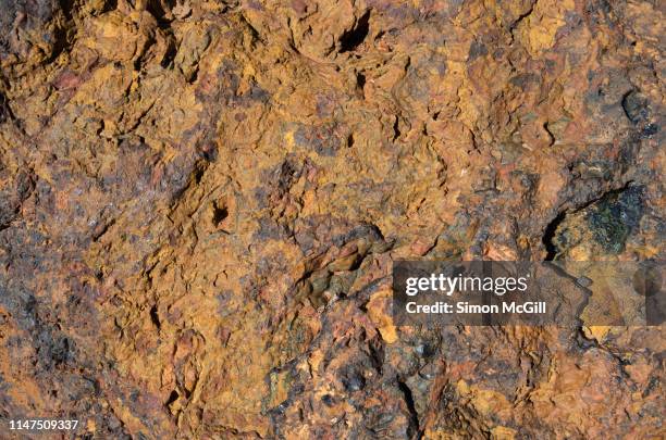 ochre coloured breccia (clastic sedimentary rock composed of large angular fragments) - sedimentary stock pictures, royalty-free photos & images